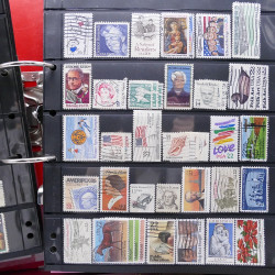 Lot massif de timbres d'Amérique et Afrique neufs et oblitérés en album.