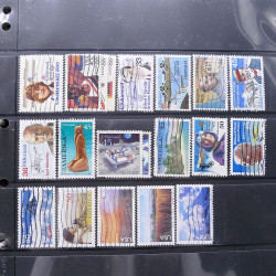 Lot massif de timbres d'Amérique et Afrique neufs et oblitérés en album.