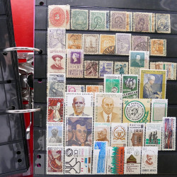 Lot massif de timbres d'Amérique et Afrique neufs et oblitérés en album.
