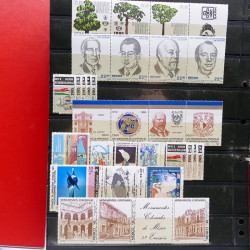 Lot massif de timbres d'Amérique et Afrique neufs et oblitérés en album.