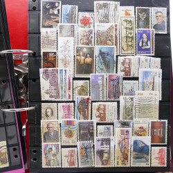 Lot massif de timbres d'Amérique et Afrique neufs et oblitérés en album.