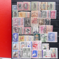 Lot massif de timbres d'Amérique et Afrique neufs et oblitérés en album.