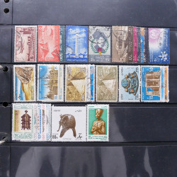 Lot massif de timbres d'Amérique et Afrique neufs et oblitérés en album.