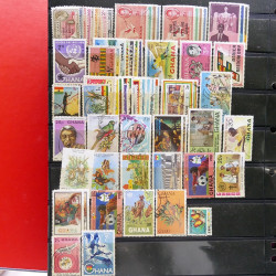 Lot massif de timbres d'Amérique et Afrique neufs et oblitérés en album.