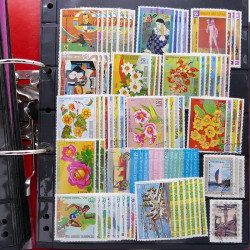 Lot massif de timbres d'Amérique et Afrique neufs et oblitérés en album.