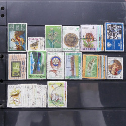 Lot massif de timbres d'Amérique et Afrique neufs et oblitérés en album.