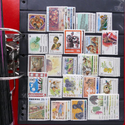 Lot massif de timbres d'Amérique et Afrique neufs et oblitérés en album.