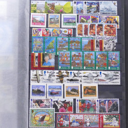 Lot de timbres d'Alderney et Guernesey oblitérés en un album.