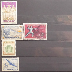 Lot de timbres d'Amérique neufs et oblitérés en un album.