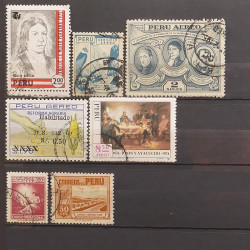 Lot de timbres d'Amérique neufs et oblitérés en un album.