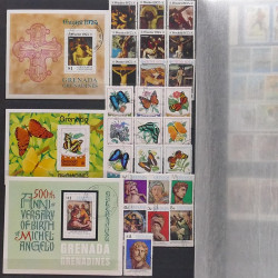 Lot de timbres d'Amérique neufs et oblitérés en un album.