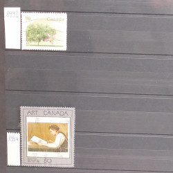 Lot de timbres d'Amérique neufs et oblitérés en un album.