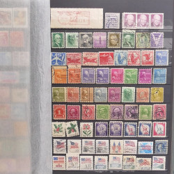 Lot de timbres d'Amérique neufs et oblitérés en un album.