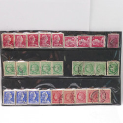 Vrac philatélique de timbres du monde neufs et oblitérés en un carton.