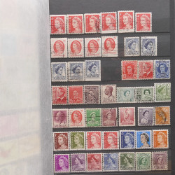 Vrac philatélique de timbres du monde neufs et oblitérés en un carton.