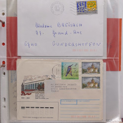 Vrac philatélique de timbres du monde neufs et oblitérés en un carton.