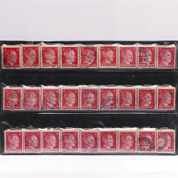 Vrac philatélique de timbres du monde neufs et oblitérés en un carton.