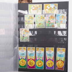 Vrac philatélique de timbres du monde neufs et oblitérés en un carton.