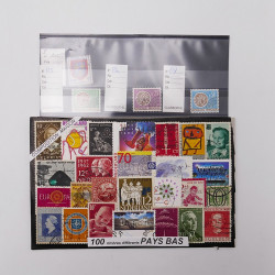 Vrac philatélique de timbres du monde neufs et oblitérés en un carton.