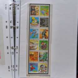 Vrac philatélique de timbres du monde neufs et oblitérés en un carton.