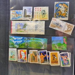 Lot massif de timbres de France oblitérés en 12 albums.