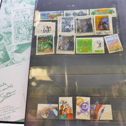 Lot massif de timbres de France oblitérés en 12 albums.