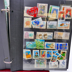 Lot massif de timbres de France oblitérés en 12 albums.