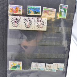 Lot massif de timbres de France oblitérés en 12 albums.