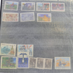 Lot massif de timbres de France oblitérés en 12 albums.