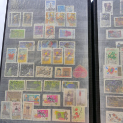 Lot massif de timbres de France oblitérés en 12 albums.