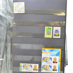 Lot massif de timbres de France oblitérés en 12 albums.