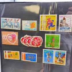 Lot massif de timbres de France oblitérés en 12 albums.