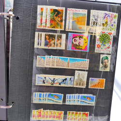 Lot massif de timbres de France oblitérés en 12 albums.