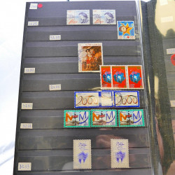 Lot massif de timbres de France oblitérés en 12 albums.