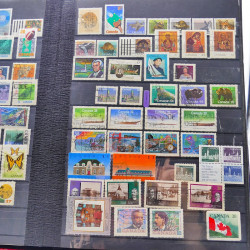 Lot massif de timbres de France oblitérés en 12 albums.