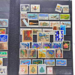 Lot massif de timbres de France oblitérés en 12 albums.