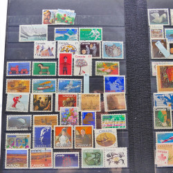 Lot massif de timbres de France oblitérés en 12 albums.