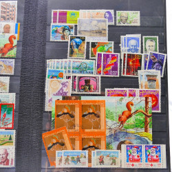Lot massif de timbres de France oblitérés en 12 albums.