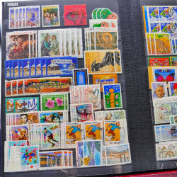 Lot massif de timbres de France oblitérés en 12 albums.