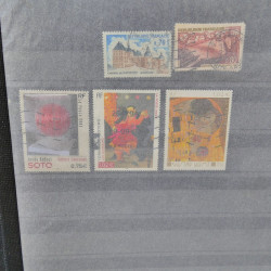 Lot massif de timbres de France oblitérés en 12 albums.